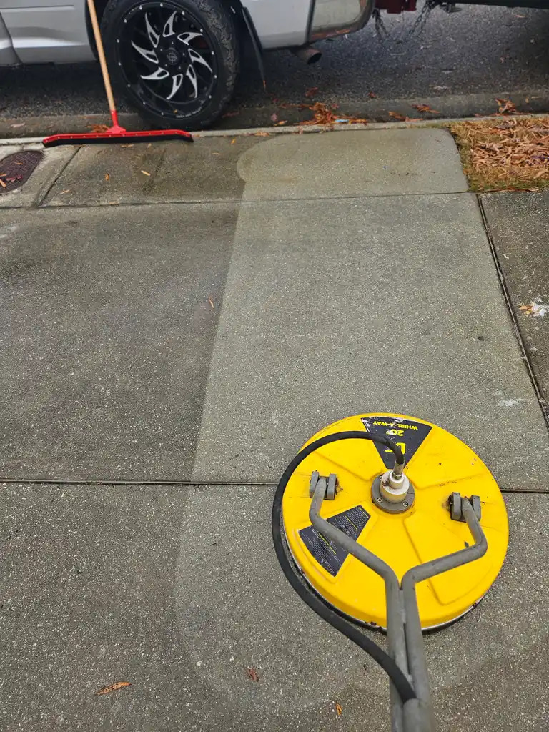 Concrete driveway cleaned with a rotary pressure washer