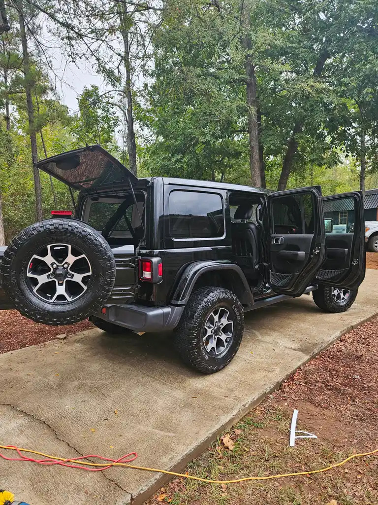 Black Jeep Wrangler detailed after a wash