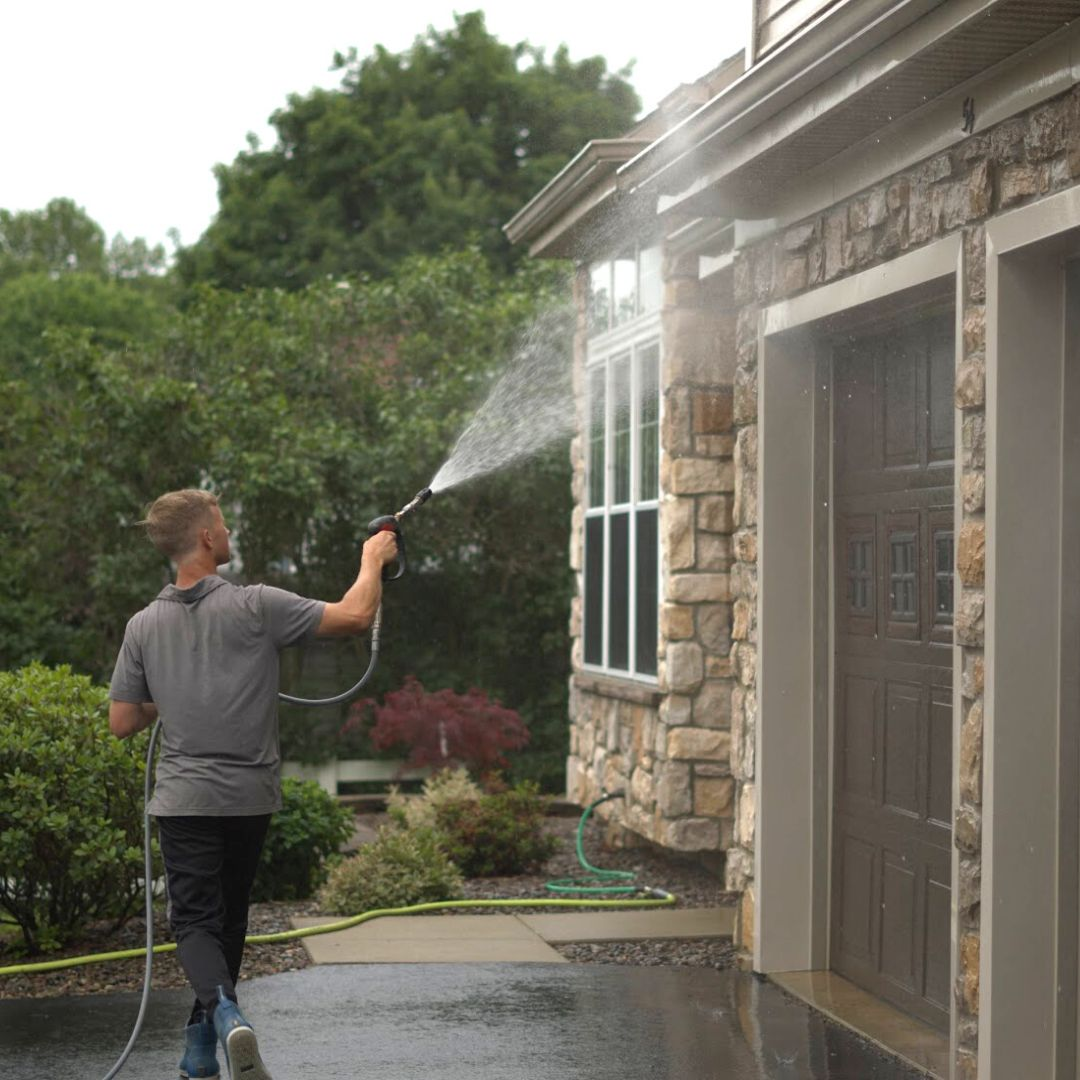 House exterior being pressure washed